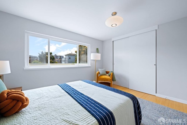 3421 25th St Unit 4, San Francisco, CA 94110 - bedroom featuring wood finished floors and a closet