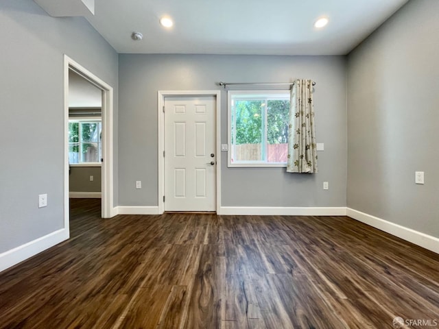 foyer entrance with dark hardwood / wood-style floors