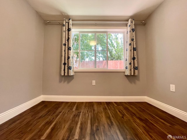 empty room featuring hardwood / wood-style flooring