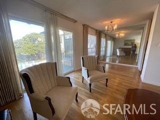 800 N Delaware St Unit 211, San Mateo, CA 94401 - sitting room with wood finished floors and a notable chandelier