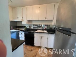 800 N Delaware St Unit 211, San Mateo, CA 94401 - kitchen featuring dark countertops, black dishwasher, a sink, and freestanding refrigerator