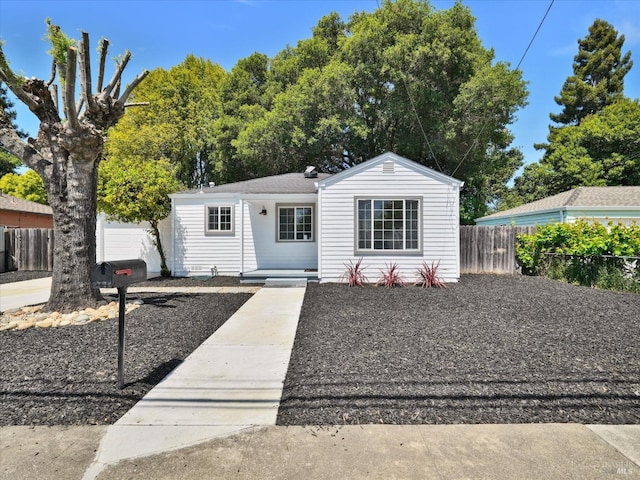 view of front of house with fence