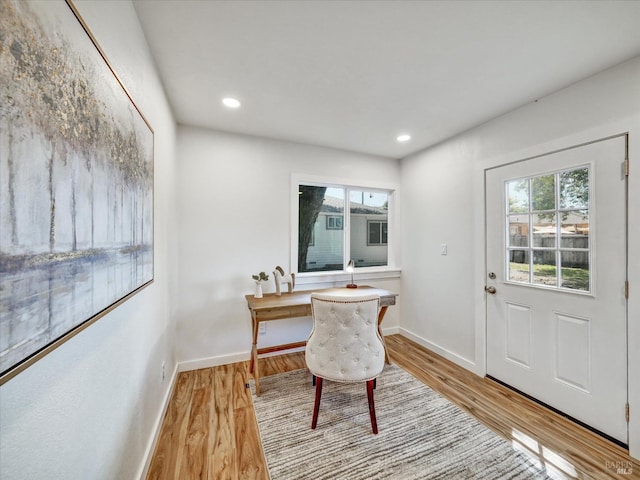 dining space featuring baseboards, recessed lighting, and wood finished floors