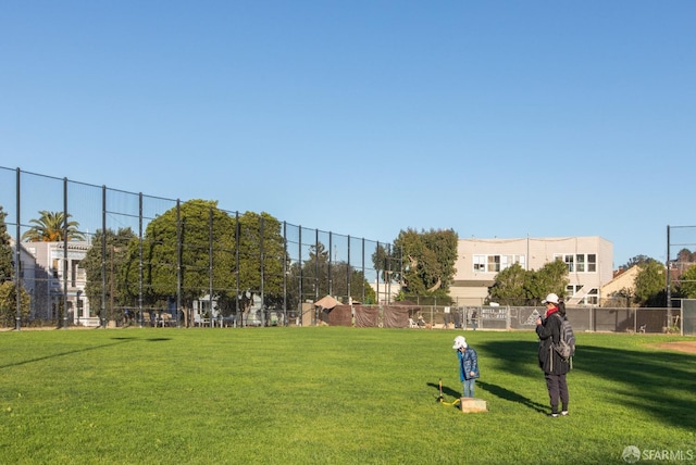 view of property's community with a yard