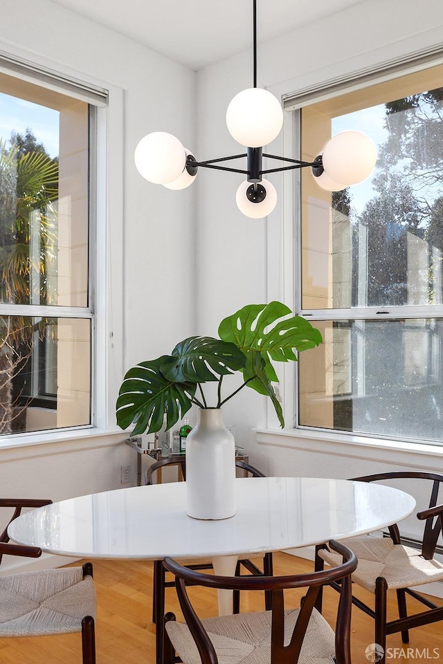 dining area with wood-type flooring