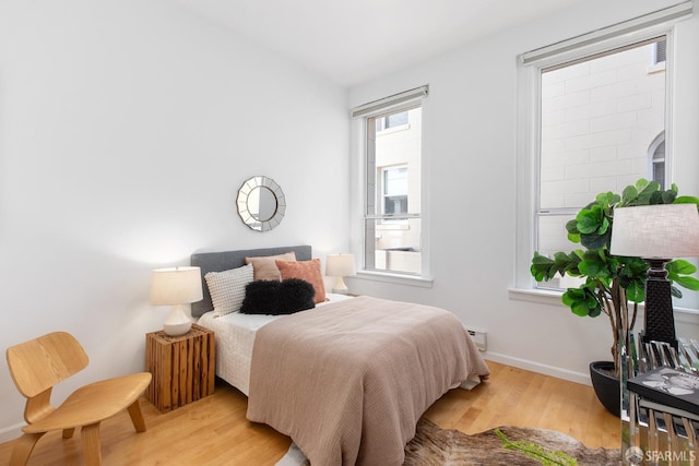 bedroom with light wood-type flooring