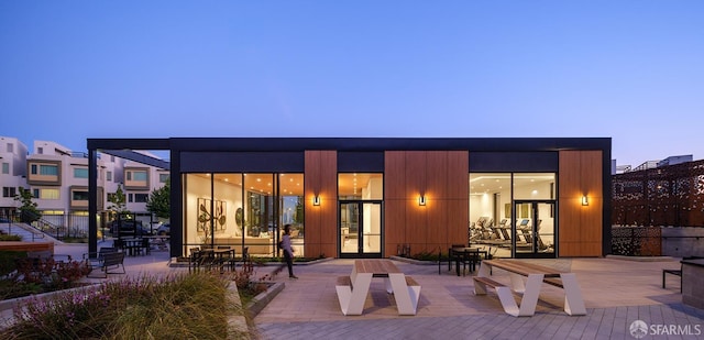 rear view of house with a patio area and french doors