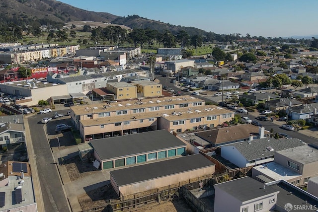 birds eye view of property featuring a mountain view