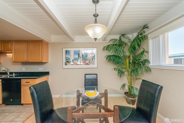 dining room with beamed ceiling, sink, and light tile patterned floors