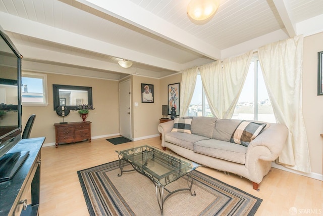 living room featuring beamed ceiling, wood ceiling, and light hardwood / wood-style flooring