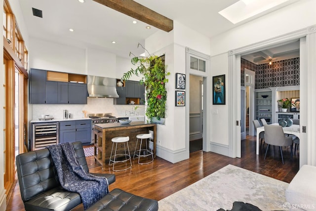 370 Sanchez St, San Francisco, CA 94114 - kitchen featuring wall chimney exhaust hood, wine cooler, high end stainless steel range oven, dark wood finished floors, and recessed lighting