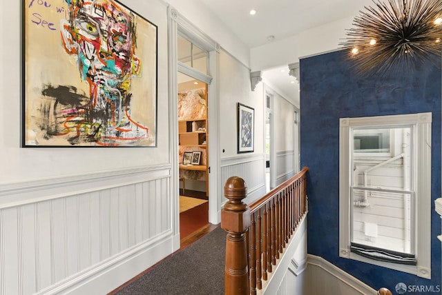 370 Sanchez St, San Francisco, CA 94114 - hallway featuring a wainscoted wall, an upstairs landing, and a decorative wall