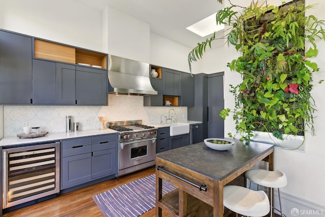 370 Sanchez St, San Francisco, CA 94114 - kitchen featuring wine cooler, luxury range, wall chimney exhaust hood, a sink, and open shelves