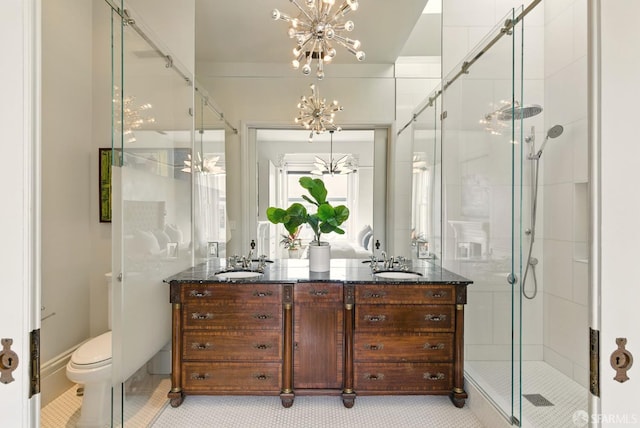 370 Sanchez St, San Francisco, CA 94114 - bathroom with a stall shower, double vanity, a chandelier, toilet, and tile patterned floors