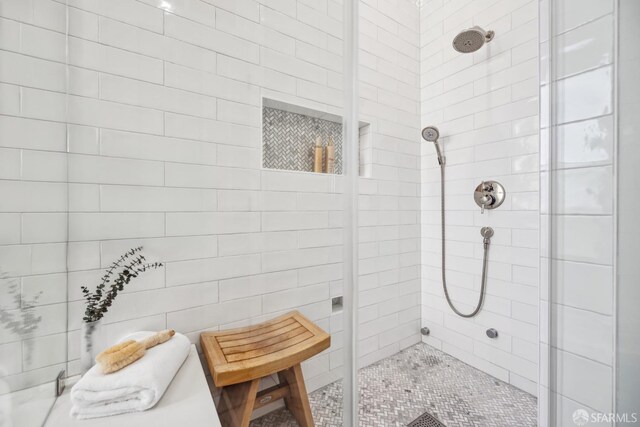 bathroom with tiled shower