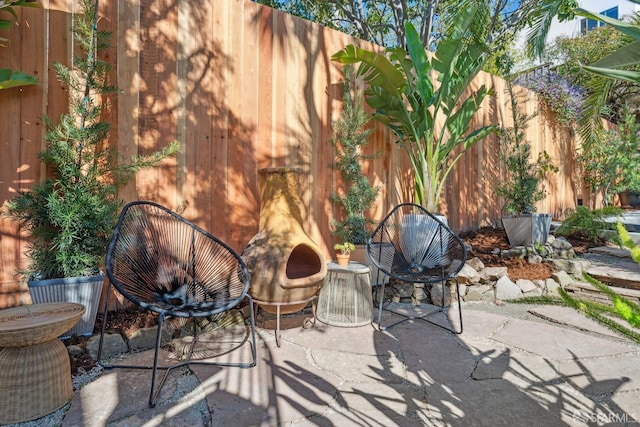 view of patio featuring fence