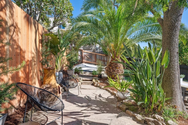 view of patio / terrace featuring fence