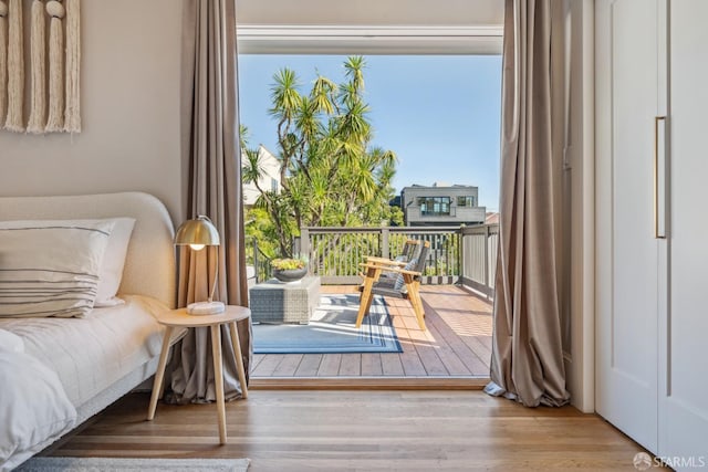 interior space featuring access to outside and wood finished floors