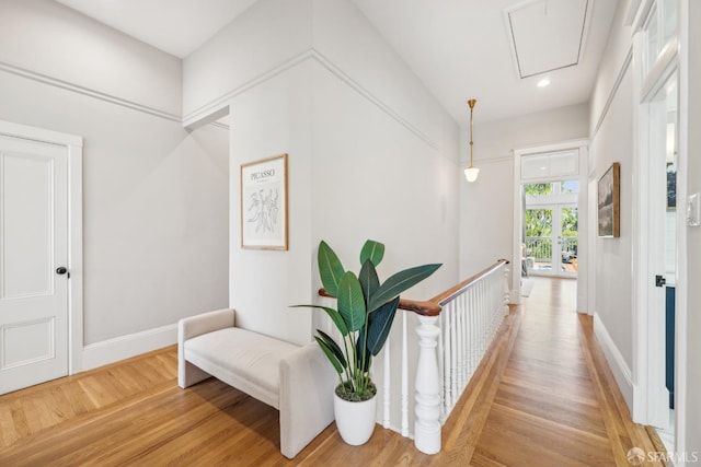 hallway with recessed lighting, an upstairs landing, baseboards, light wood-type flooring, and attic access