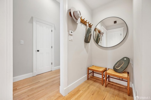 interior space with light wood-style floors and baseboards