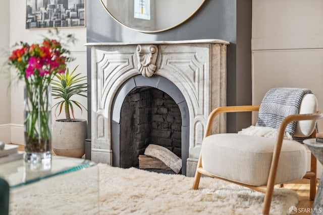 sitting room with a fireplace