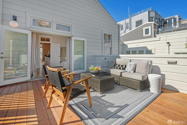 wooden terrace featuring an outdoor hangout area