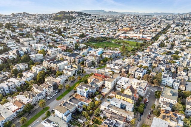 drone / aerial view featuring a residential view and a mountain view