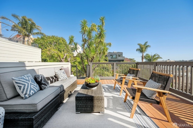 wooden deck featuring outdoor lounge area