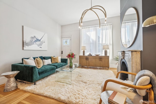 living area featuring a fireplace and wood finished floors