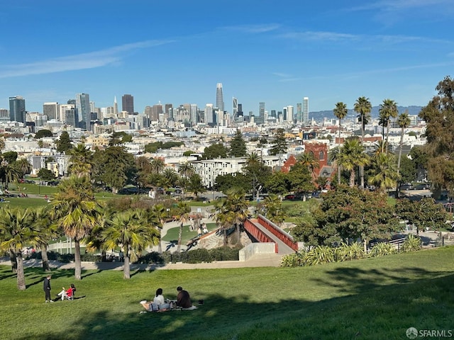 exterior space with a lawn and a city view