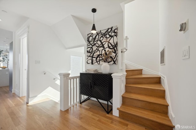 stairway featuring hardwood / wood-style flooring