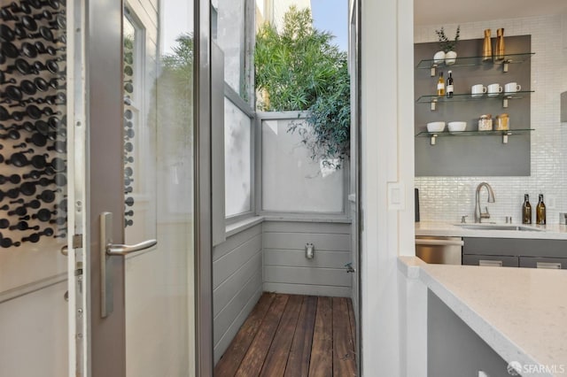 bathroom featuring vanity, decorative backsplash, hardwood / wood-style flooring, and an enclosed shower