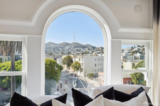 interior space with a wealth of natural light and a mountain view