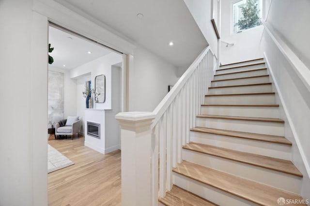 staircase featuring hardwood / wood-style floors