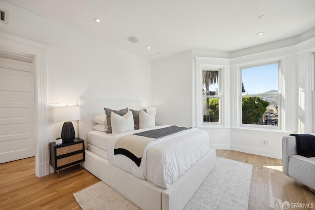 bedroom with light hardwood / wood-style floors