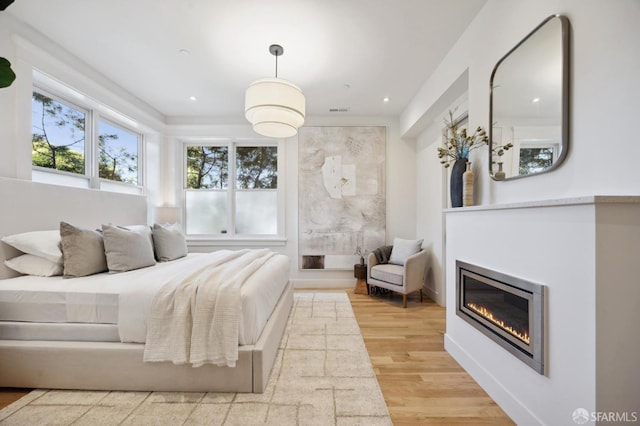 bedroom with light hardwood / wood-style flooring