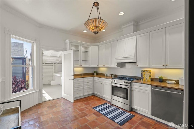 787 Arguello Blvd, San Francisco, CA 94118 - kitchen with stainless steel appliances, crown molding, white cabinets, hanging light fixtures, and recessed lighting