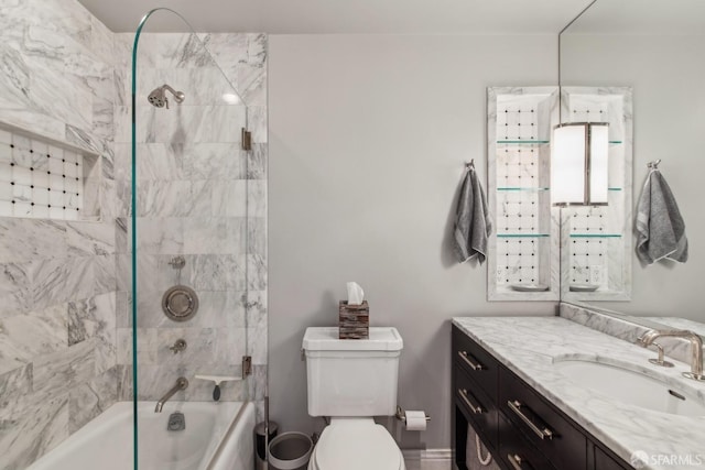 bathroom featuring toilet, vanity, and shower / tub combination