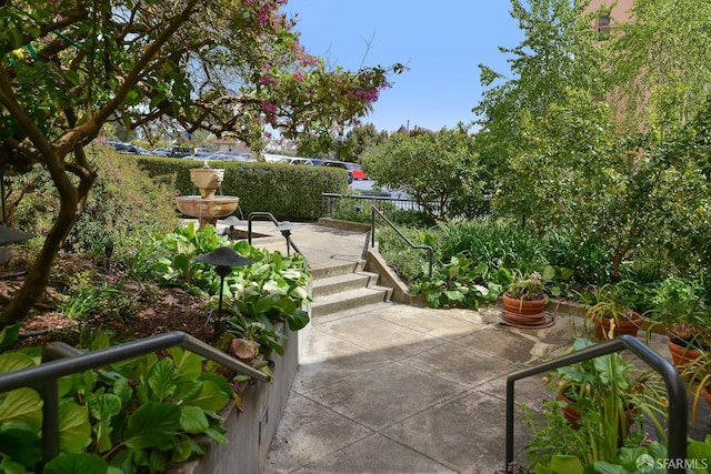 view of property's community featuring a patio