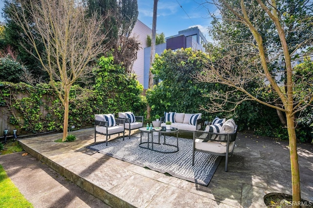 view of patio / terrace featuring fence and an outdoor hangout area