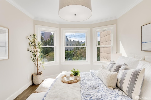 bedroom featuring wood finished floors, baseboards, and ornamental molding