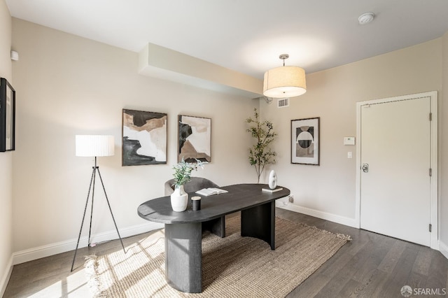 office area featuring baseboards and wood finished floors