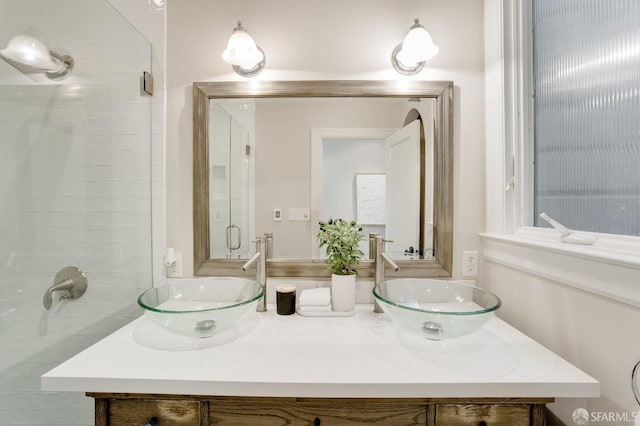 bathroom featuring double vanity and a sink