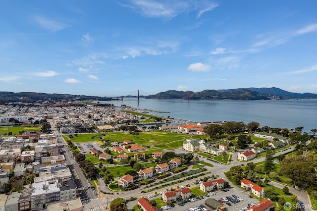 birds eye view of property featuring a water and mountain view