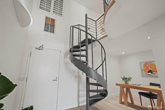 39 Boardman Pl Unit 105, San Francisco, CA 94103 - stairway with wood finished floors, a towering ceiling, and recessed lighting