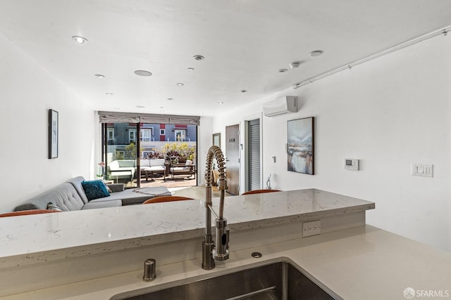 interior space featuring sink and an AC wall unit