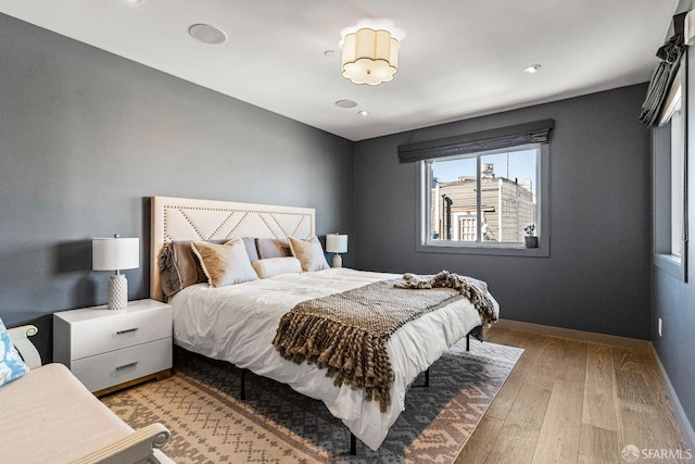 bedroom with light hardwood / wood-style floors