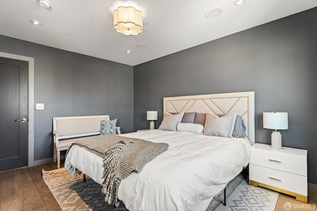 bedroom with hardwood / wood-style flooring