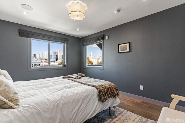 bedroom featuring wood-type flooring