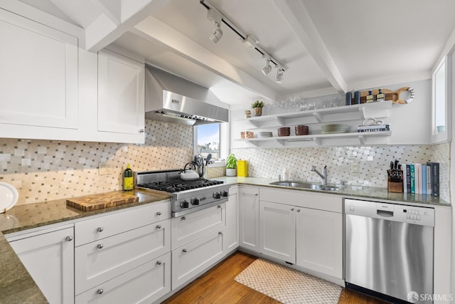3294 Clay St Unit 6, San Francisco, CA 94123 - kitchen featuring appliances with stainless steel finishes, dark stone countertops, ventilation hood, and white cabinets